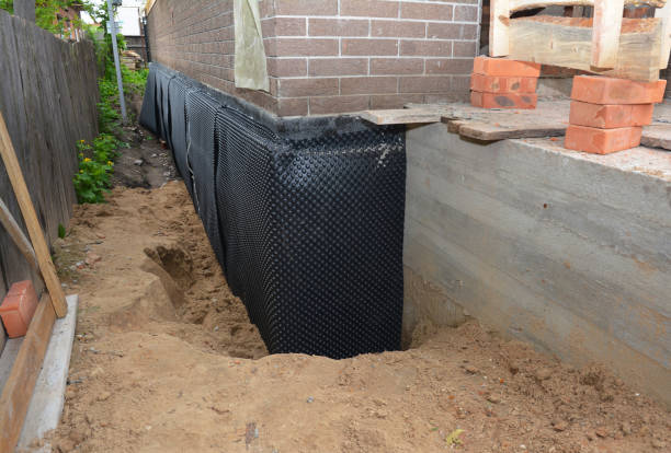SJ Waterproofing Pros technician performing targeted Basement Waterproofing assessment in Vienna, VA